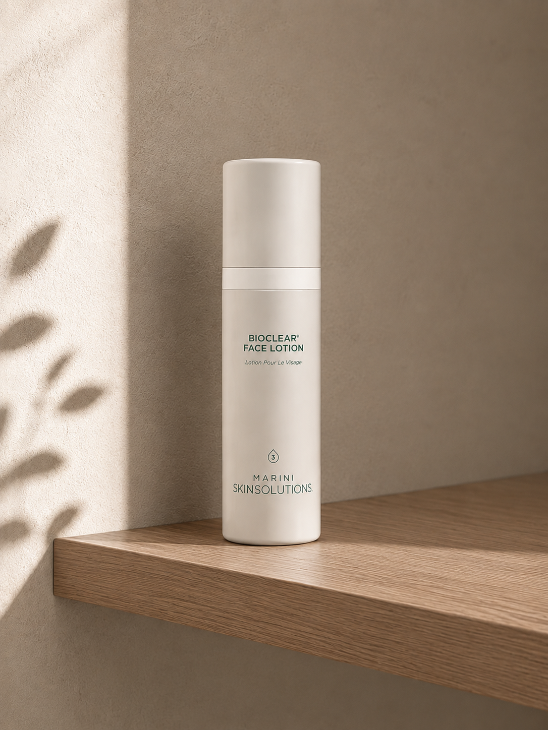 Jan Marini Bioclear Face Lotion exfoliating acne lotion in a sage green pump bottle.