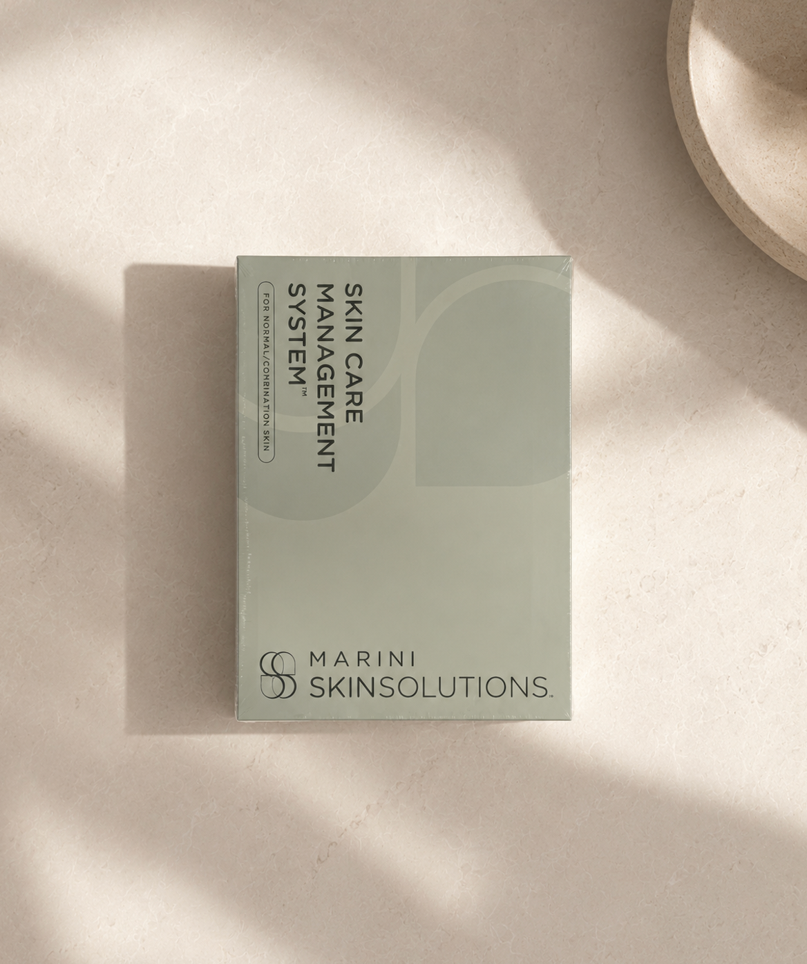 Marini skin solutions skin care management system set laying on rock counter at L&P Skin Shop