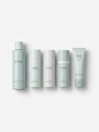Jan Marini Skin Care Management System five-piece kit with cleanser, serum, lotion, cream and SPF lined up.