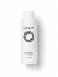 Nutrafol Root Purifier scalp microbiome shampoo in a tall white bottle.