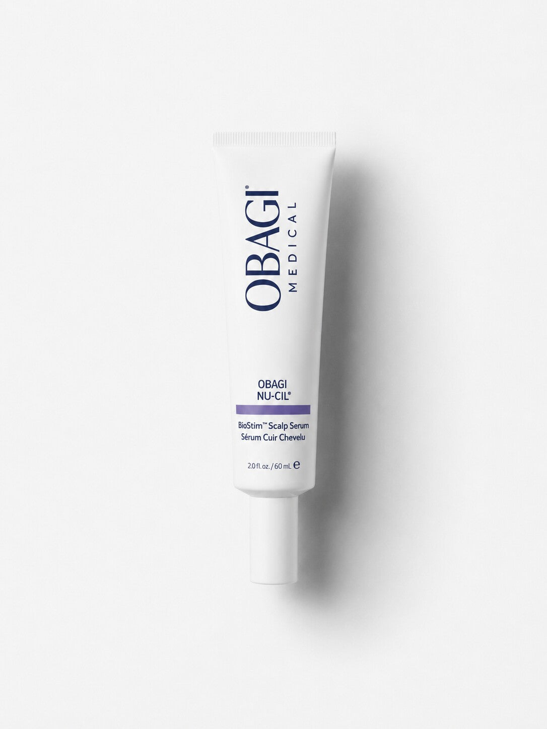 Obagi Nu-Cil BioStim Scalp Serum for thicker-looking hair in a white squeeze tube.