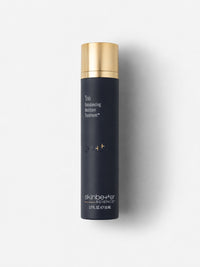 skinbetter science Trio Rebalancing Moisture Treatment in a navy airless bottle with gold cap.