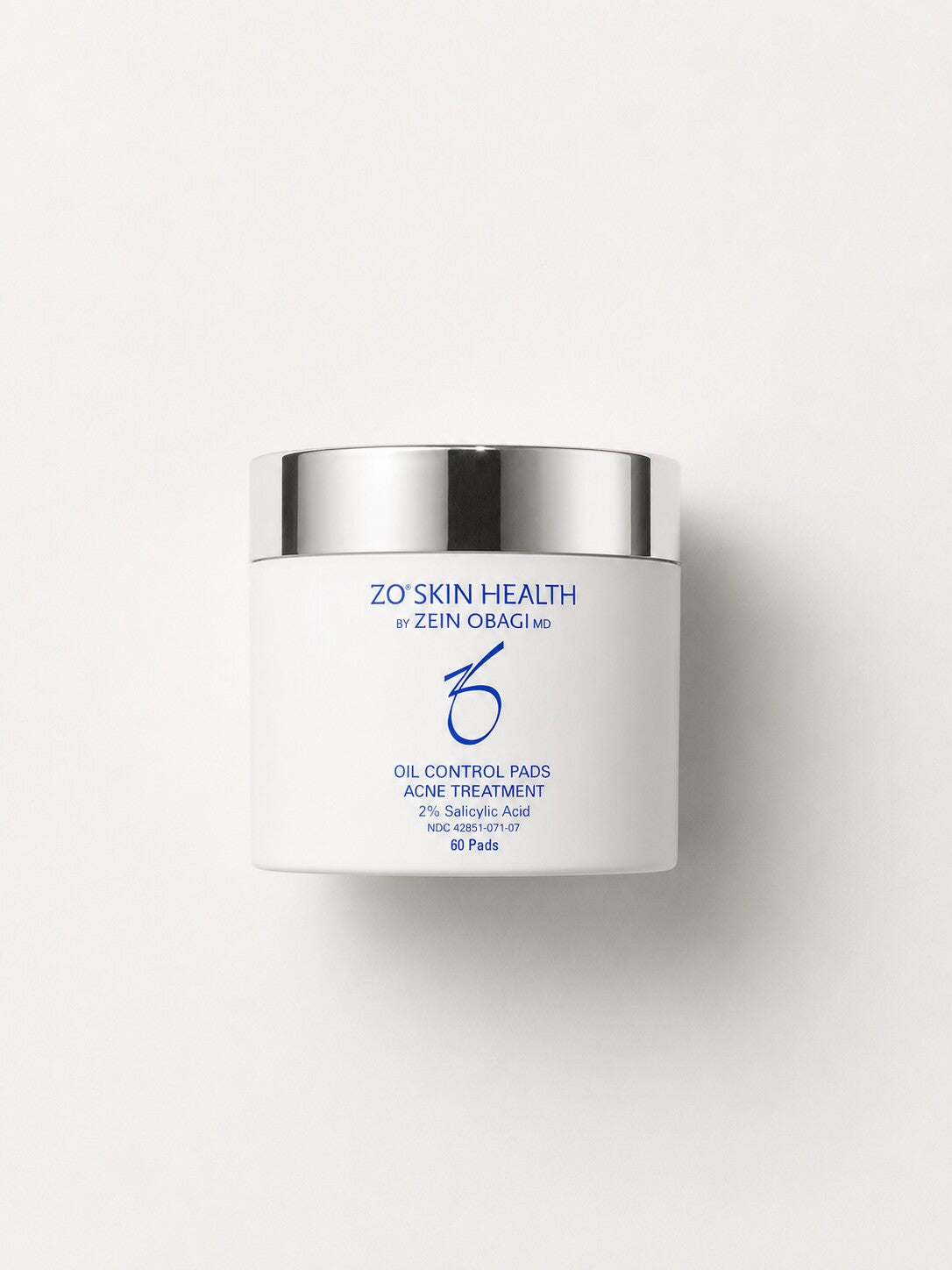 ZO Skin Health Oil Control Pads acne treatment pads in a white jar with silver lid, 60 count.
