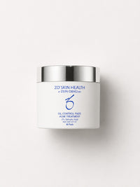 ZO Skin Health Oil Control Pads acne treatment pads in a white jar with silver lid, 60 count.